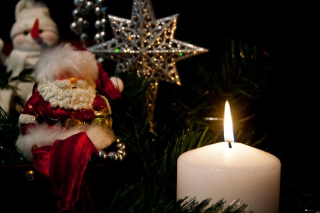 Christmas decorations by candlelightの写真素材