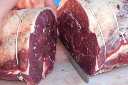 Cutting rolled beef roastsの写真素材