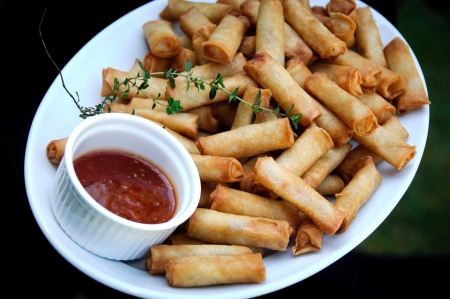 spring rolls with chilli sauce dipの写真素材