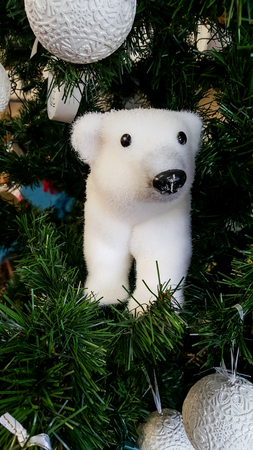 Polar bear decoration in Xmas Tree with other decorationsの写真素材