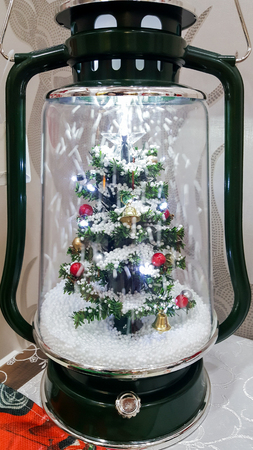 Glass surround Christmas ornament with a tree insideの写真素材