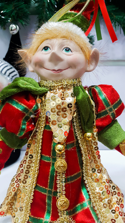 Christmas elf in detailed costume with a happy smile on faceの写真素材