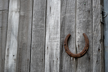 Old shed details with an old rusty horseshoe to use to open doorの写真素材