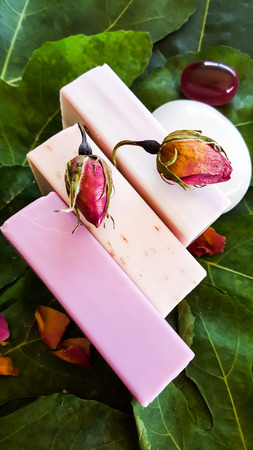 Selection of soaps with rose petals for spa treatmentの写真素材