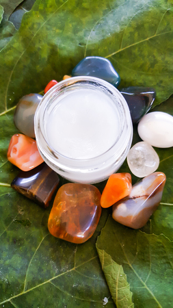 Lavender face cream with a selection of crystalsの写真素材