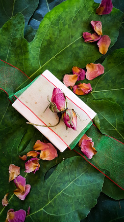 Rose scented homemade soap with rose petalsの写真素材