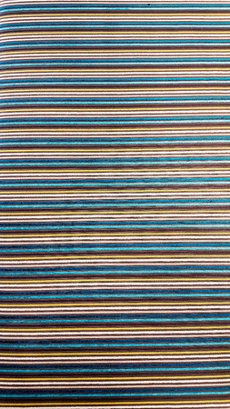 Background pattern of multi colored striped materialの写真素材