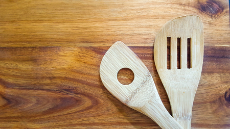 Wooden Spoons on a wooden cutting boardの写真素材
