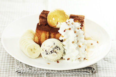 ice cream and toasted bread with bananaの写真素材