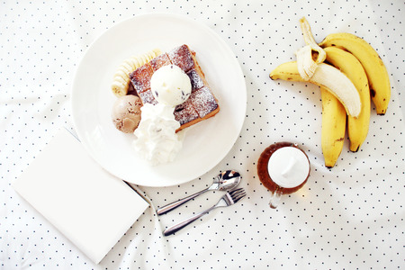 ice cream and toasted bread with bananaの写真素材