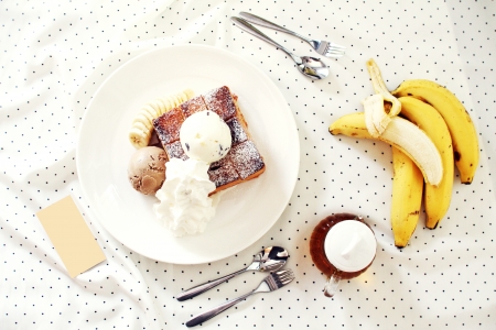 ice cream and toasted bread with bananaの写真素材