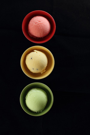colorful ice cream arranged as traffic lightの写真素材
