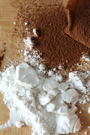 Cocoa powder and flour on a plateの写真素材