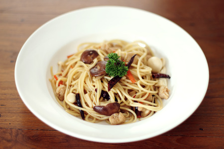 spaghetti with mushroom for vegan on wooded tableの写真素材