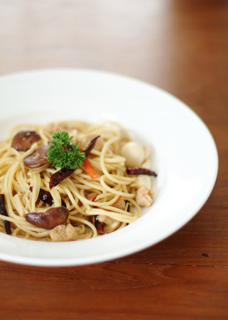 spaghetti with mushroom for vegan on wooded tableの写真素材