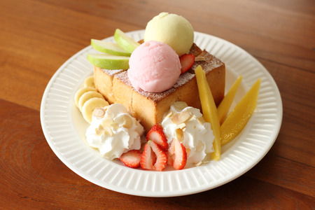 ice cream and toasted bread with fruitの写真素材