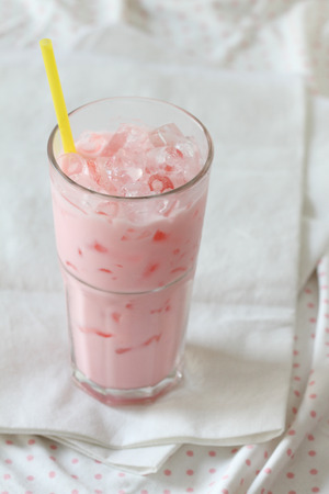 a glass strawberry flavored milkの写真素材