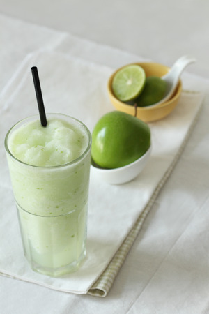 fresh apple smoothies drinks on white backgroundの写真素材