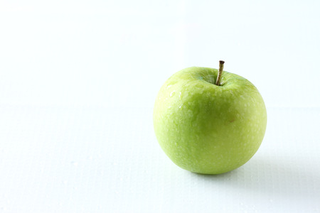 fresh green apple on white backgroundの写真素材