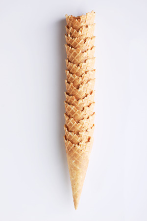 row of empty ice cream cones on white backgroundの写真素材