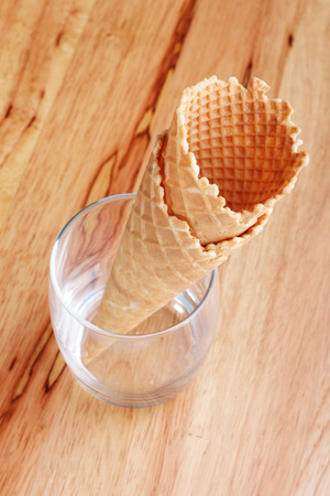 ice cream cones in a  clear glass on wooden backgroundの写真素材