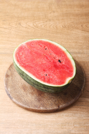 fresh watermelon on wooden backgroundの写真素材