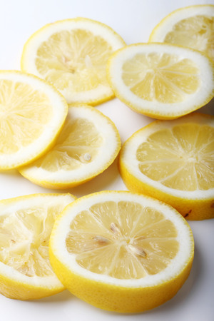 stack of citrus fruits slices. lemons. On white backgroundの写真素材