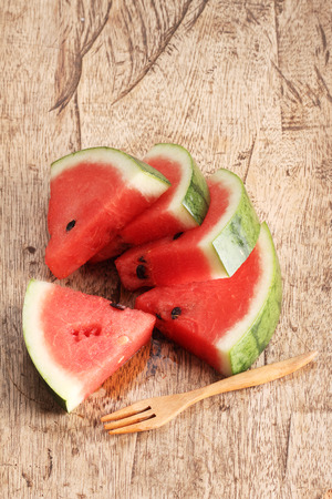 Watermelon, Slices of fresh watermelon on wooden backgroundの写真素材