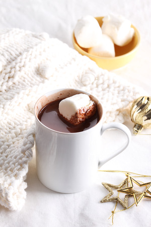 hot chocolate drink with celebration decorations on white backgroundの写真素材
