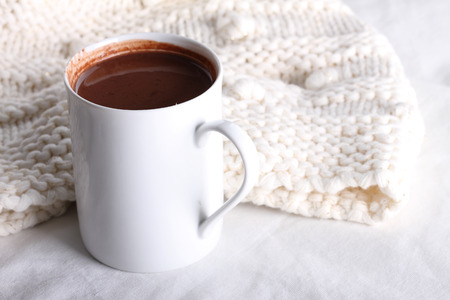 hot chocolate drink in white mug on white backgroundの写真素材