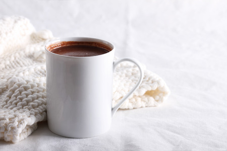 hot chocolate drink in white mug on white backgroundの写真素材