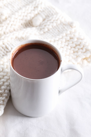 hot chocolate drink in white mug on white backgroundの写真素材