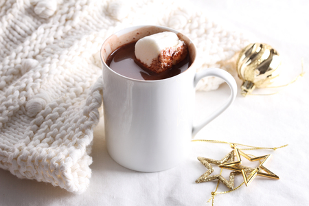 hot chocolate drink with celebration decorations on white backgroundの写真素材