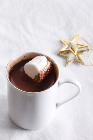 hot chocolate drink in white mug on white backgroundの写真素材