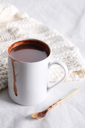 hot chocolate drink in white mug on white backgroundの写真素材