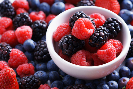strawberries, blueberries, raspberries and black berries. fresh berries on white backgroundの写真素材