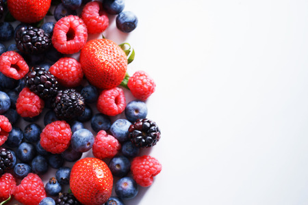strawberries, blueberries, raspberries and black berries. fresh berries on white backgroundの写真素材