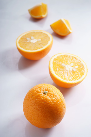 citrus fruits slices. Oranges. On white marble tableの写真素材