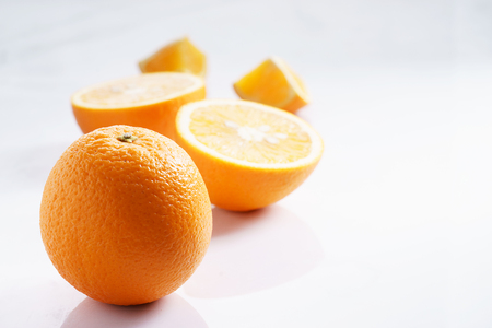 citrus fruits slices. Oranges. On white marble tableの写真素材