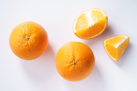 citrus fruits slices. Oranges. On white marble tableの写真素材