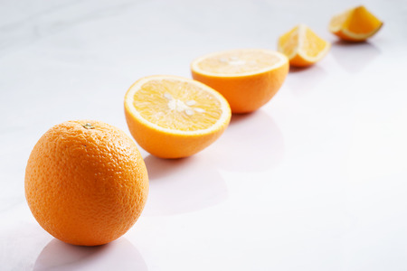 citrus fruits slices. Oranges. On white marble tableの写真素材