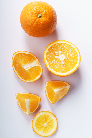 citrus fruits slices. Oranges. On white marble tableの写真素材
