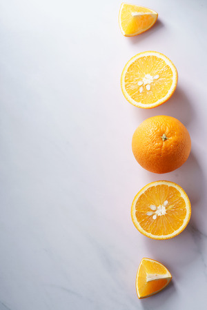 citrus fruits slices. Oranges. On white marble tableの写真素材