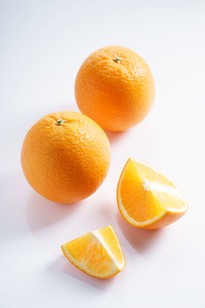 citrus fruits slices. Oranges. On white marble tableの写真素材