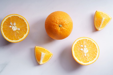 citrus fruits slices. Oranges. On white marble tableの写真素材