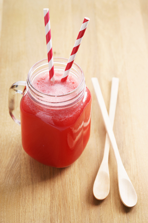 Healthy watermelon drink  on wooden backgroundの写真素材