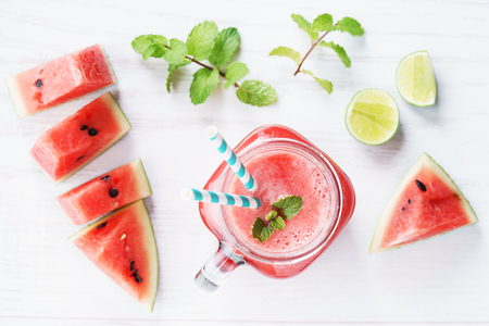 Healthy watermelon drink and fresh watermelon on white backgroundの写真素材