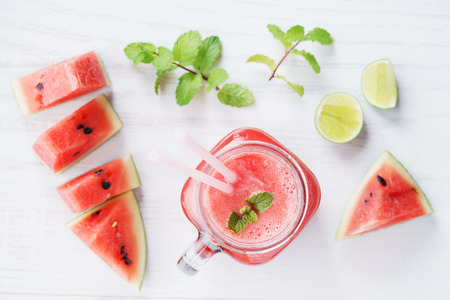 Healthy watermelon drink and fresh watermelon on white backgroundの写真素材