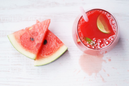 Healthy watermelon drink and fresh watermelon on white backgroundの写真素材