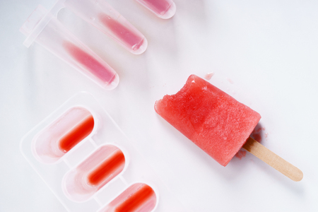 Homemade watermelon popsicles on white marble backgroundの写真素材